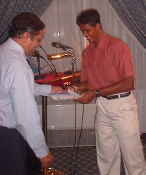 Left arm spinner Sajeewa Weerakoon receives the Man of the Tournament award