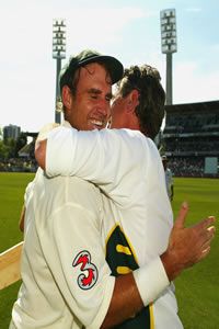 Matthew Hayden of Australia is congratulated by physio Errol Alcott after breaking Brian Lara of the West Indies world record of 375