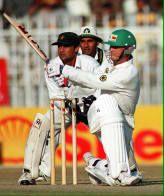 Aamir Sohail and Moin Khan watch Andy Flower hit a boundary