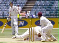 Symcox dives for the crease but is run out