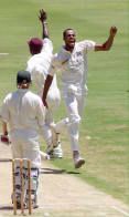 Walsh celebrates the dismissal of Bacher, caught by Philo Wallace