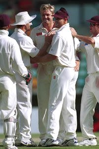 Scott Muller  celebrates with team mates after taking a wicket