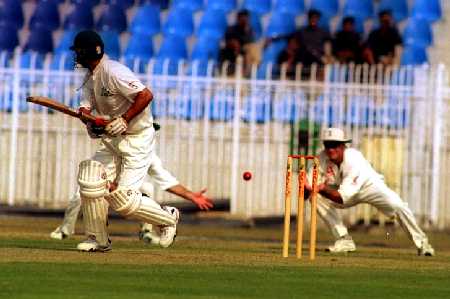 Hick reaches for the catch as Imran Abbas edges