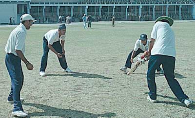 Rakesh Patel giving catch practice to Sodhi, Doru and Gambhir