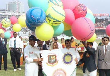 Bangladesh Prime Minister Sheik Hasina holding a banner with Sourav Ganguly and Naimur Rahman