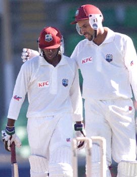 Jimmy Adams congratulates his deputy Campbell on reaching his century