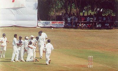 Shahbuddin being congratulated by team members after Ganesh got out