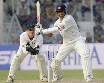 Dravid positions himself to pull the ball from Brian Murphy