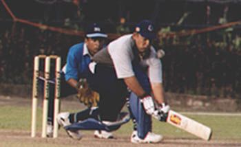Sajith Fernando top edges a sweep and is caught