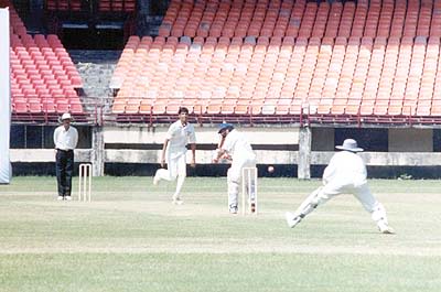 Dinesh Rao tries to flick the ball from Chandran