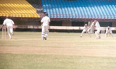 A Kudua places the ball to the off side from the bowling of Aware