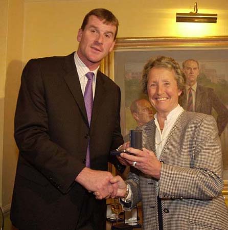Yorkshire skipper David Byas presented with his CricInfo Championship medal by Rachael Hayhoe-Flint
