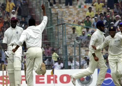 Harbhajan and Sehwag celebrate after snaring last man Cuffy