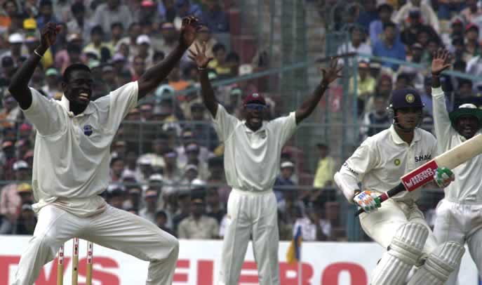 The celebrations begin for Cuffy after Asoka De Silva rules Ganguly lbw