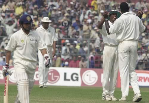 High fives for Cameron Cuffy after dismissing Sachin Tendulkar