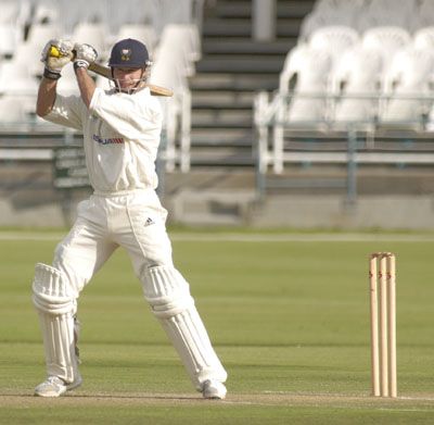 Neil Johnson drives a ball against North West