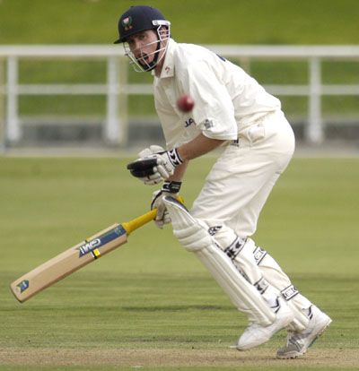 Neil Johnson drives a ball against North West