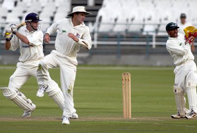 Neil Johnson square drives a ball against North West
