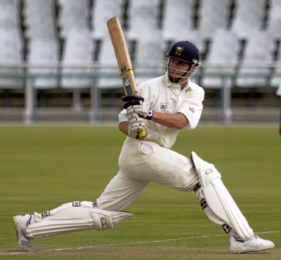 Neil Johnson sweeps a ball against North West
