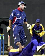 Dinusha Fernando dives to catch Andrew Strauss