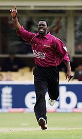 Carl Greenidge celebrates
