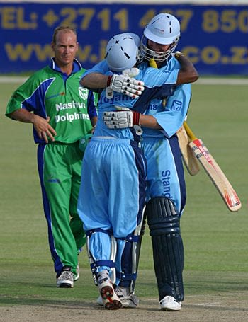 Gerald Dros and Geoffrey Toyana celebrate victory