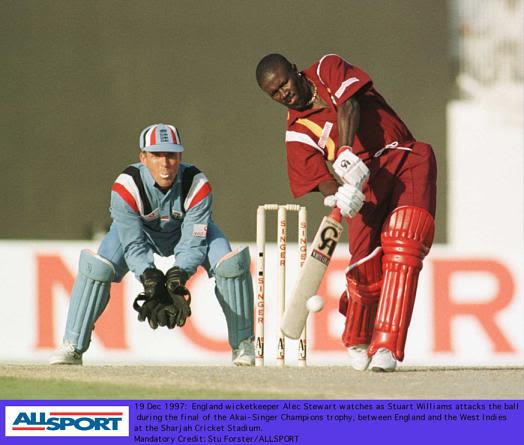 Stuart Williams on the attack, Alec Stewart watches.