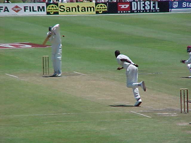 Symcox spoons a catch to Lambert