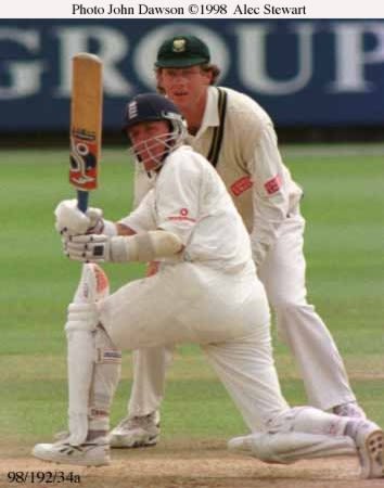 Alec Stewart drives the ball