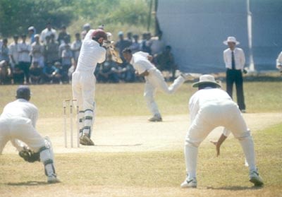 Shanker plays Ahmed down the pitch