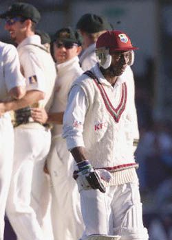 A dejected Campbell trudges back to the pavilion