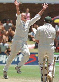 Kerry Walmsley celebrates after knocking over Daryll Cullinan's offstump