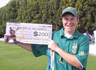 Terblanche proudly poses with the player of the match award