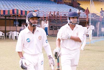 M Beerala and J Arun Kumar go out to open the Karnataka innings