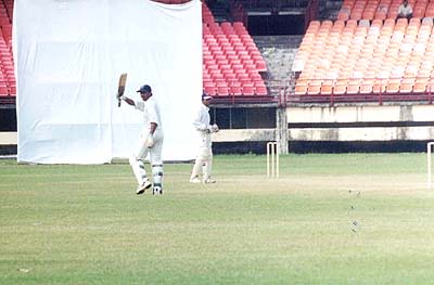 Oasis acknowledges the cheers after reaching his sixth Ranji century for Kerala