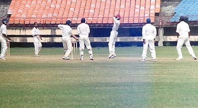 Mahesh plays the ball from Suresh Kumar to the off side