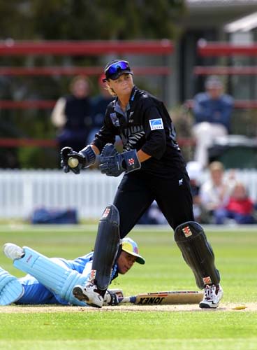 Indian batter Deepa Kulkarni slides along the ground but fails to cross the line and is run out for 4 by White Ferns captain Emily Drumm