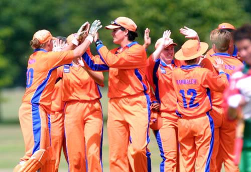 Netherlands players celebrate the wicket of O'Neill