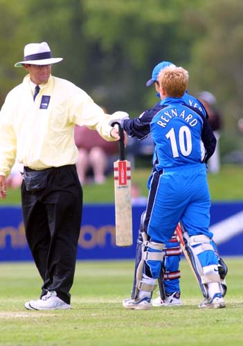 New Zealand umpire Dave Quested hands back Melissa Reynards bat