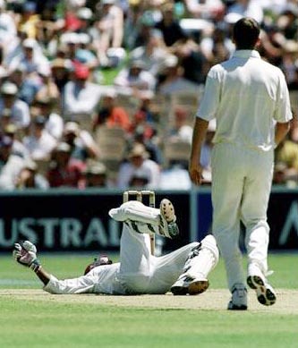 Opener Sherwin Campbell is felled by a McGrath bouncer