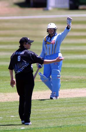 Purnima Rau raises her hand as she reached her half century and went on to finish with 67 not out