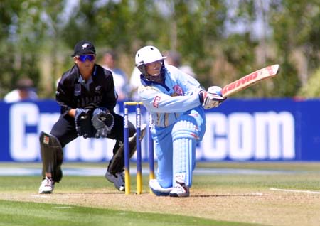 Indian opener Purnima Rau sweeps the ball out to the boundary for 4 runs