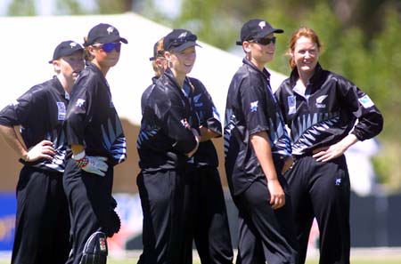 White Ferns gather as they wait for the decision on the run out by Rachel Pullar