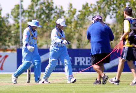 Sky TV crew lead out the Indian openers, Smitha Harikrishna and Purnima Rau