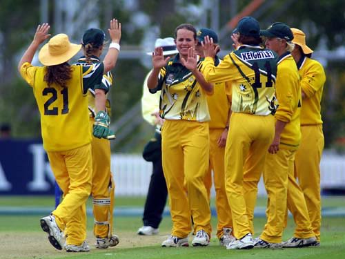 Australian team celebrates the wicket of Debbie Hockley