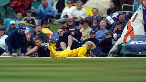 Cherie Bambury dives in the outfield