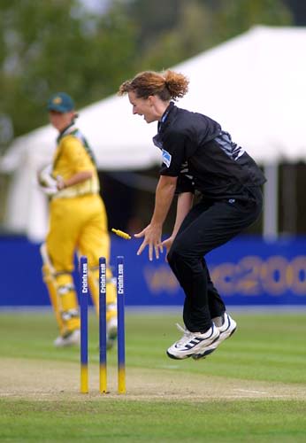 New Zealand bowler Katrina Keenan leaps in the air after a direct hit by Helen Watson to dismiss Karen Rolton