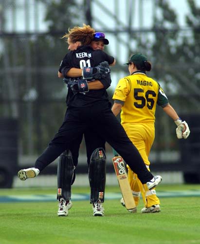 New Zealand bowler Katrina Keenan hugs wicketkeeper Rebecca Rolls as Olivia Magno leaves the crease