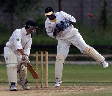 Kennedy Otieno drops a chance off the bat of Gavin Rennie