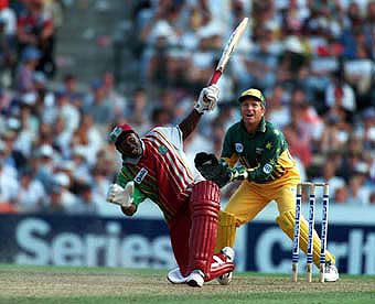 Junior Murray loses his balance as he hits a catch to Bevan off Warne, Healy is the keeper